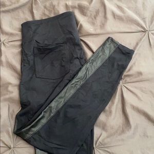 Black stretchy pants with faux leather stripes